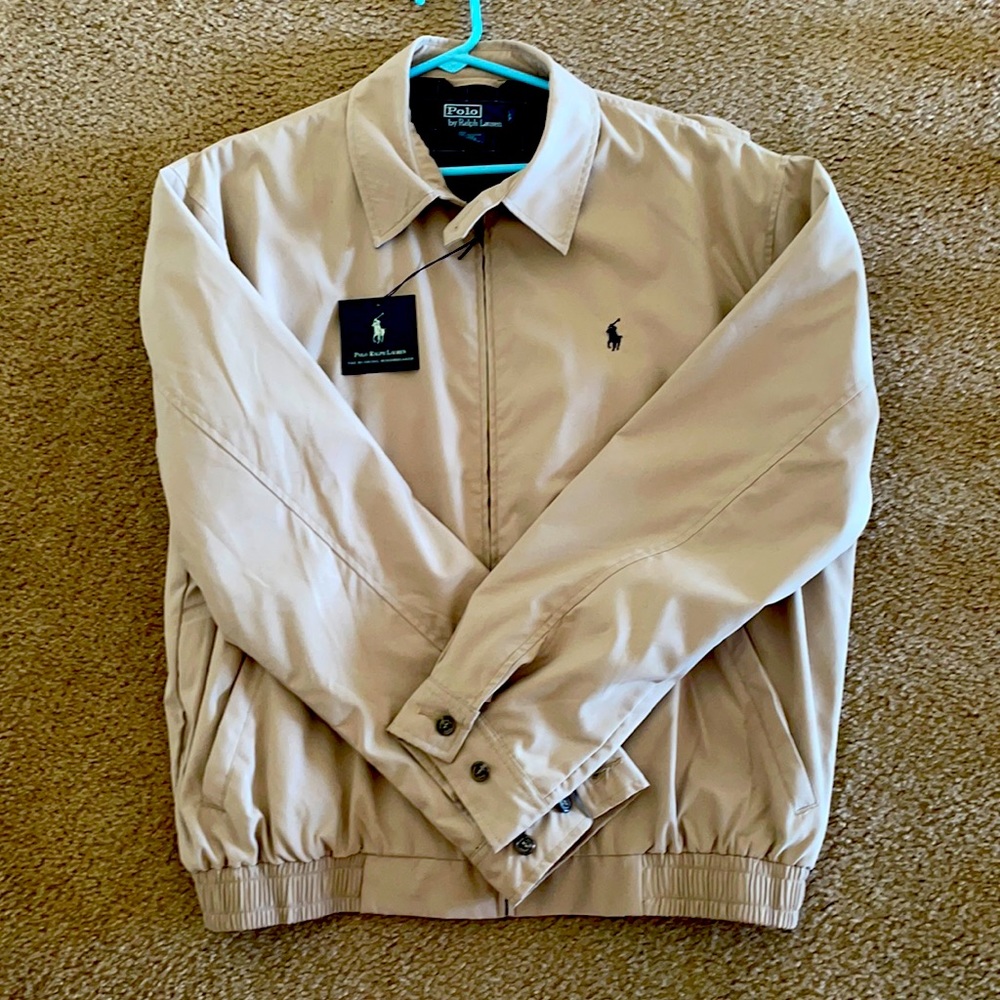 Men’s Polo jacket in tan in size L. It’s called the Bi-Swing Windbreaker!